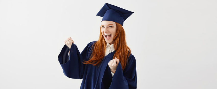 Excited graduate in cap and gown celebrating completion of HND and Diploma courses.