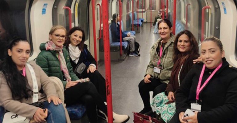 Group of women traveling on the London Underground for the Exploring Career Pathways – Stratford Job Show.