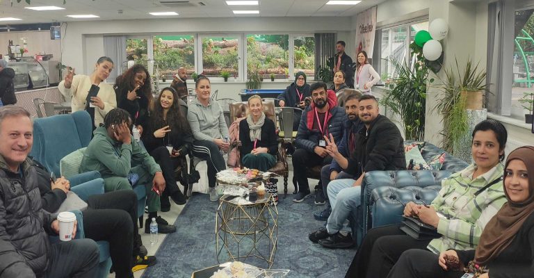 Attendees gathered and smiling during the October Monthly Meeting Café – Fostering Confidence at Mont Rose College.