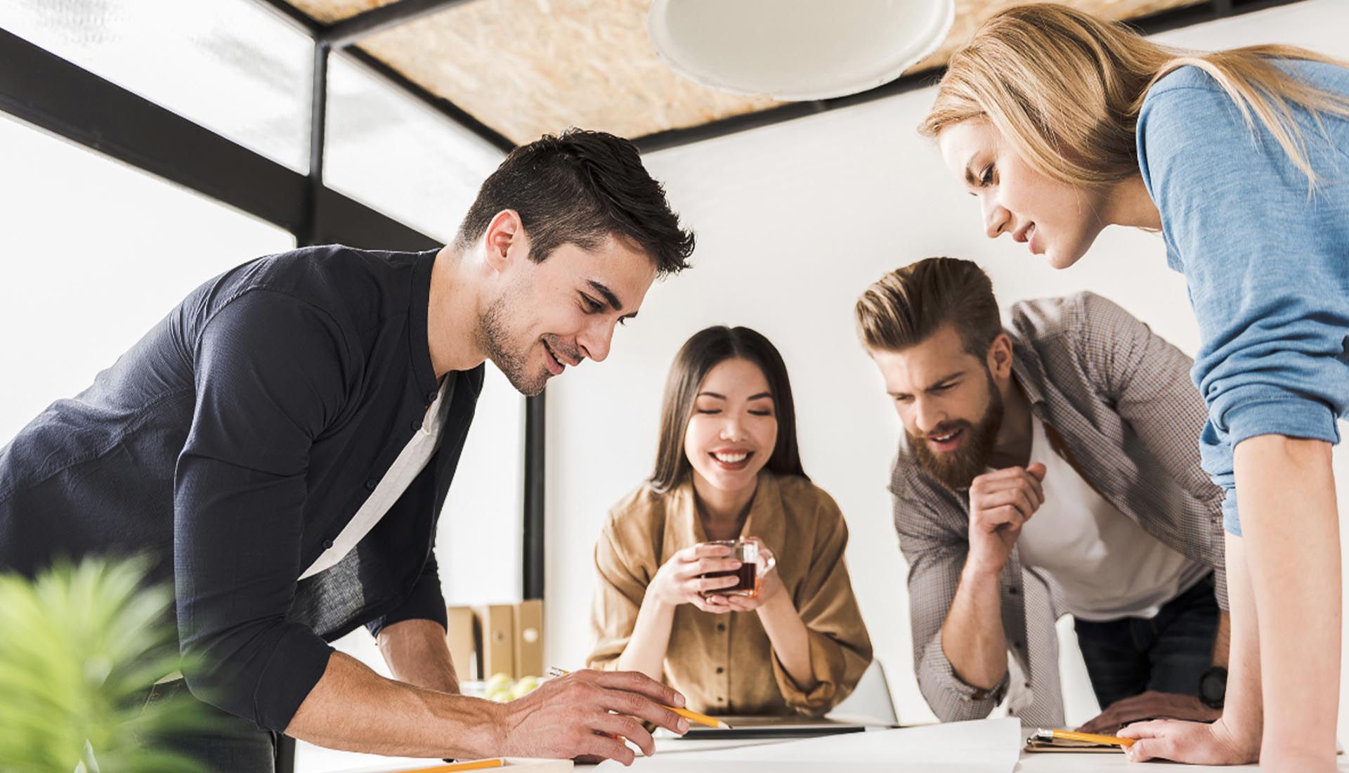 A collaborative team brainstorming in a bright office, highlighting opportunities to elevate your career with an HND qualification.
