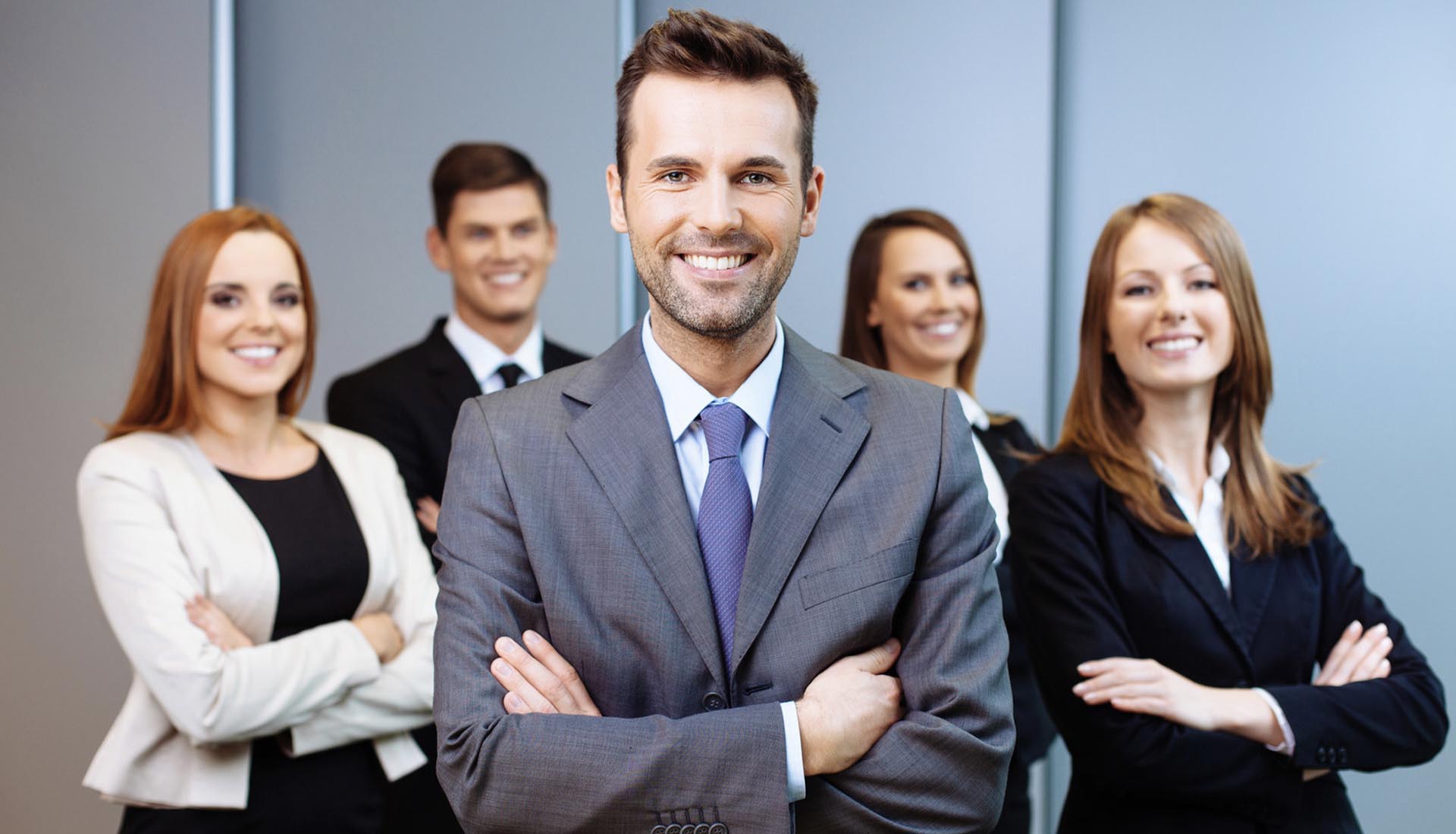 A confident professional team in formal attire, showcasing how to elevate your career with an HND qualification.