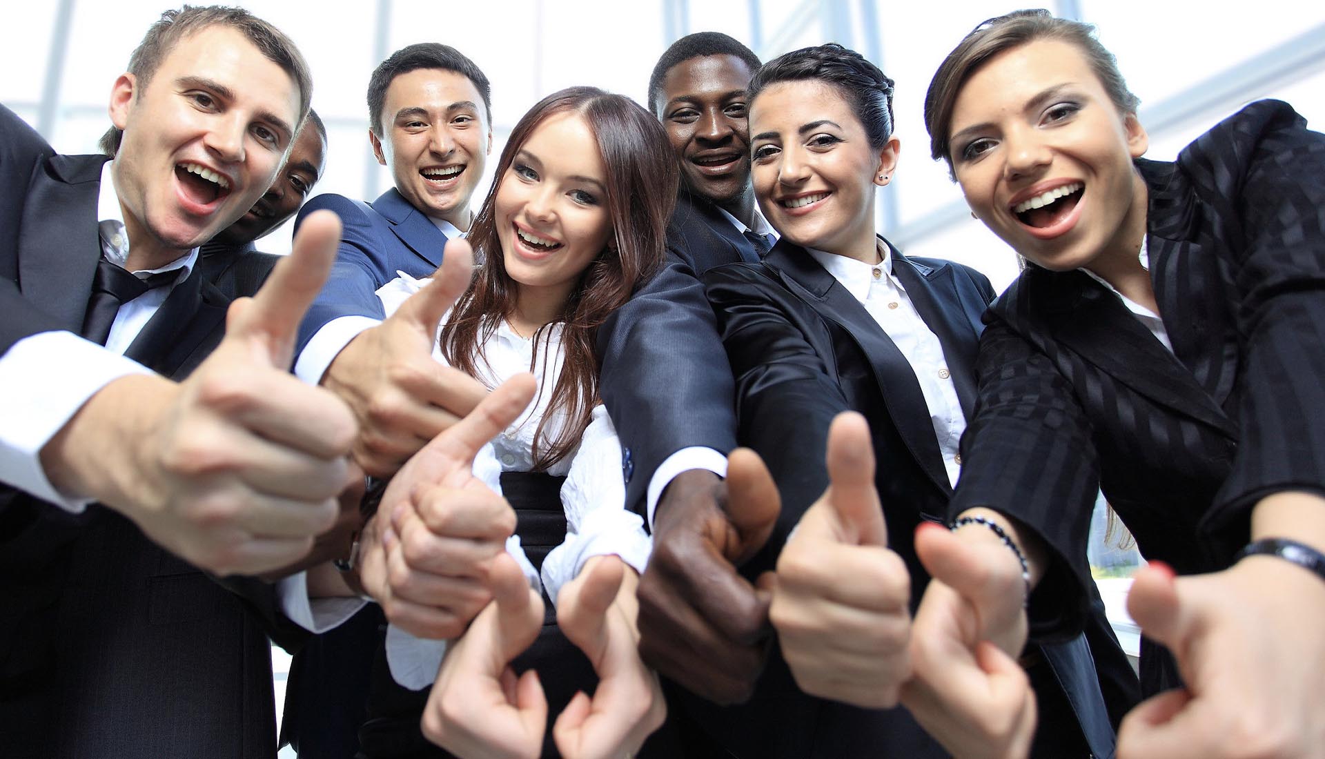 A group of professionals smiling and giving thumbs up, showcasing enthusiasm for HND and career pathways opportunities.