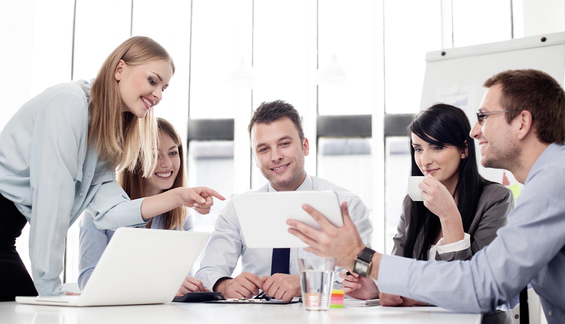 Professionals collaborating in a bright office, highlighting how to elevate your career with an HND qualification.