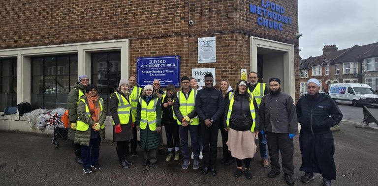 Volunteers and MRC students gather outside Ilford Methodist Church in high-visibility vests, participating in a Greener Ilford Lane litter-picking initiative