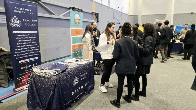 Mont Rose College representatives engaging with students at Atam Academy’s Careers Fair 2025, promoting educational opportunities and career pathways.