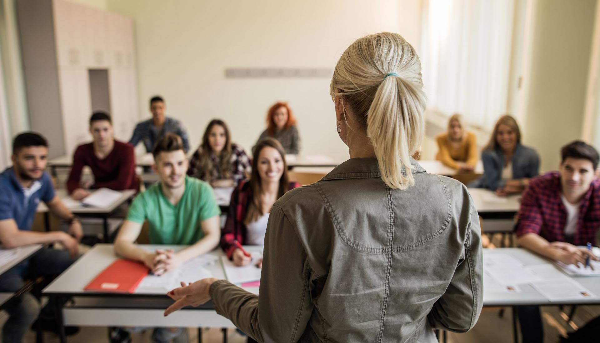 Teacher addressing a classroom of attentive students HND Qualifications