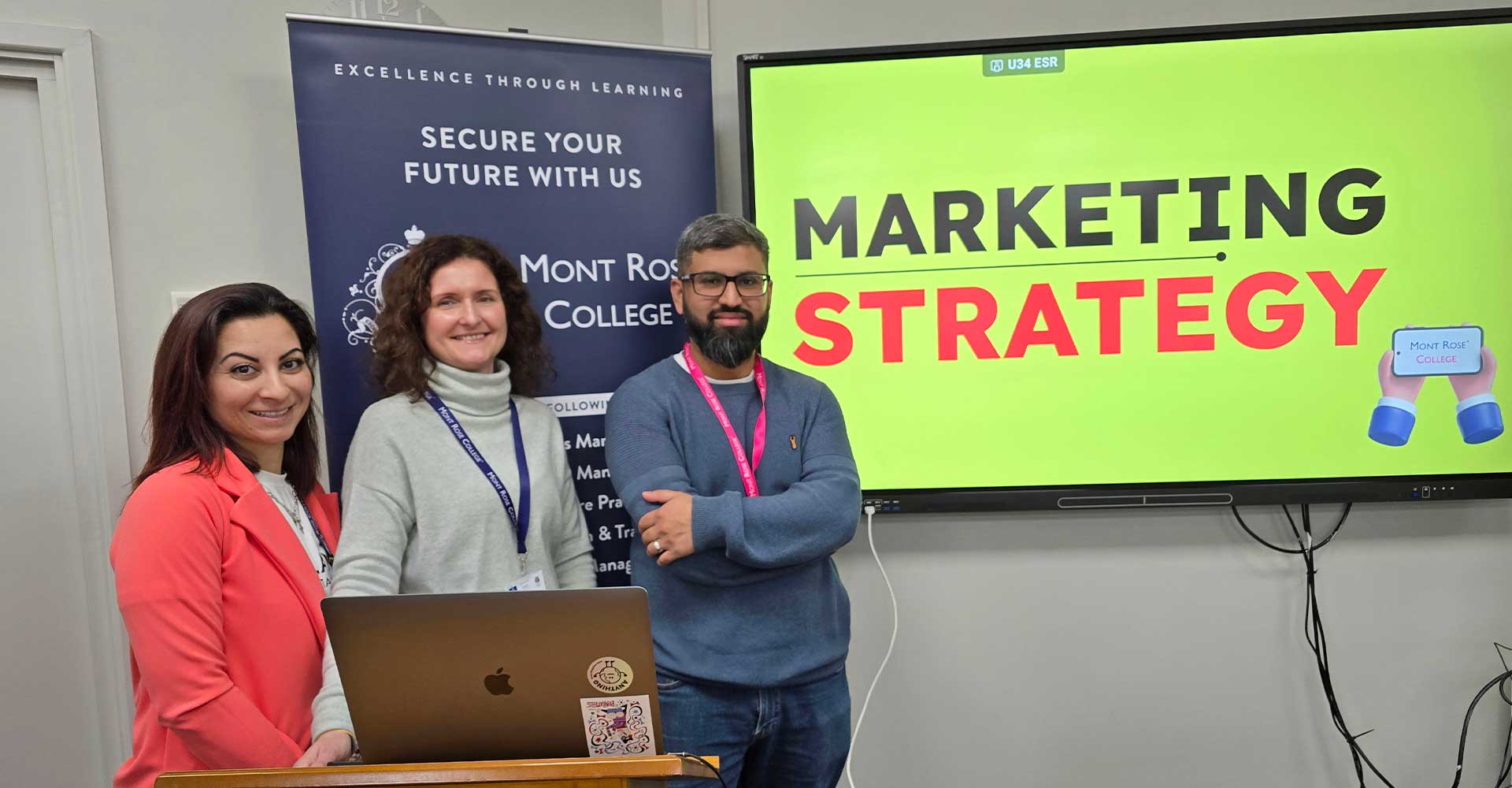 Three presenters standing by a screen displaying “Marketing Strategy” during the Empowering Students with Marketing Strategy – Zamil Zareen Session.