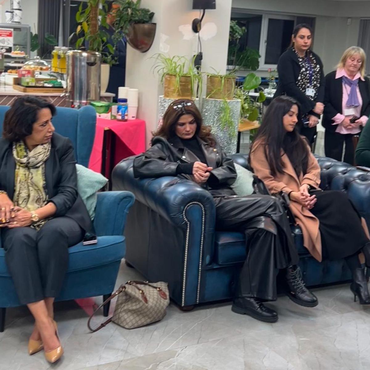 Women seated in a discussion at Mont Rose College, fostering
