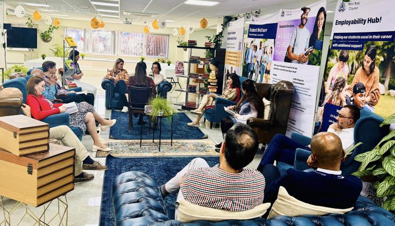 A group discussion in a cozy, book-filled setting at Mont Rose College, celebrating World Book Day with engaging conversations.