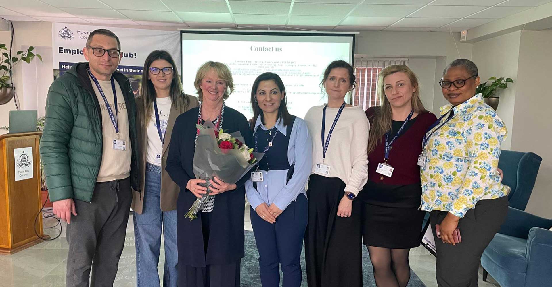 Group photo with Jennifer Holloway holding flowers after speaking at the Jennifer Holloway Inspires Students at Employability Seminar.