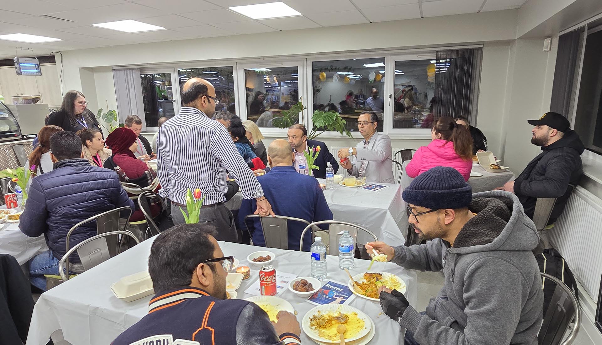 Guests enjoying a communal meal at the Iftar Dinner at Mont Rose College, fostering unity and celebration during Ramadan.