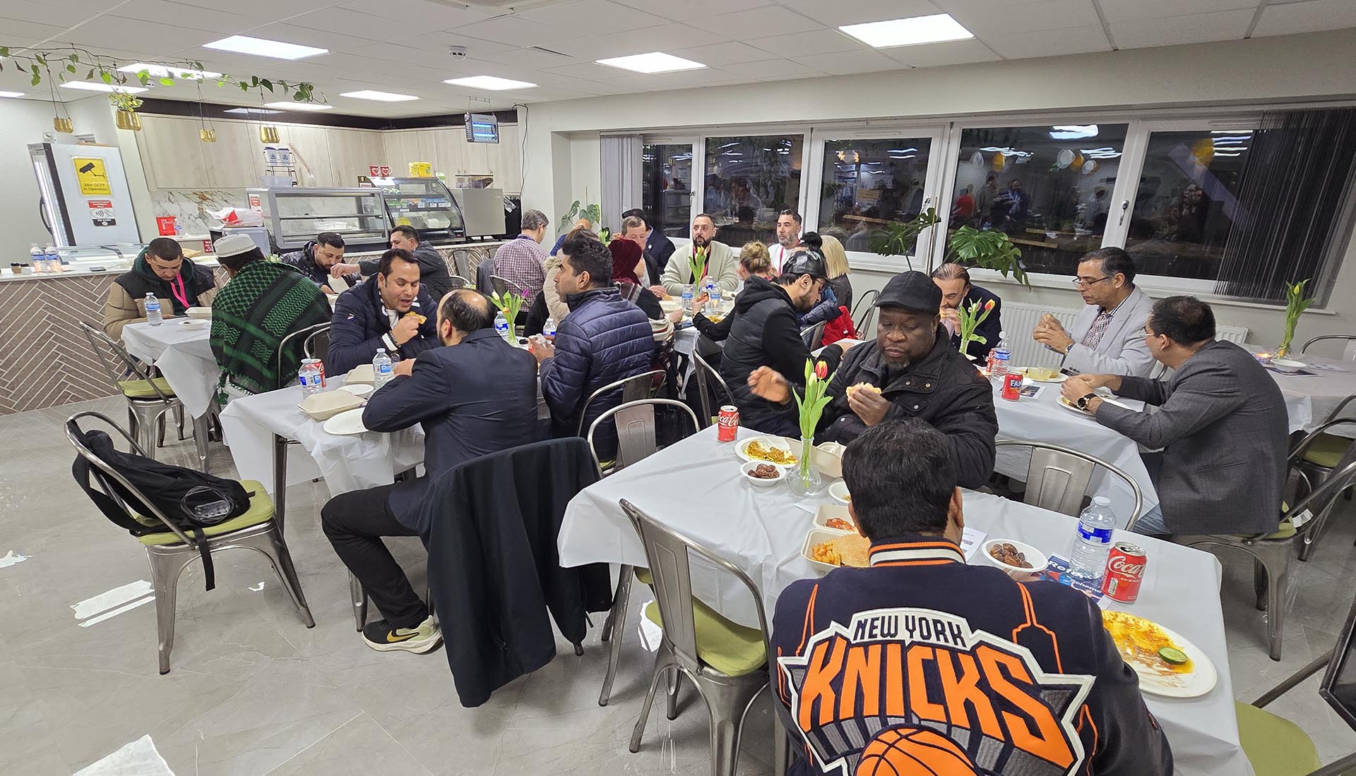 Guests gathered at Mont Rose College for the Iftar Dinner, enjoying a meal together in a warm and festive atmosphere.