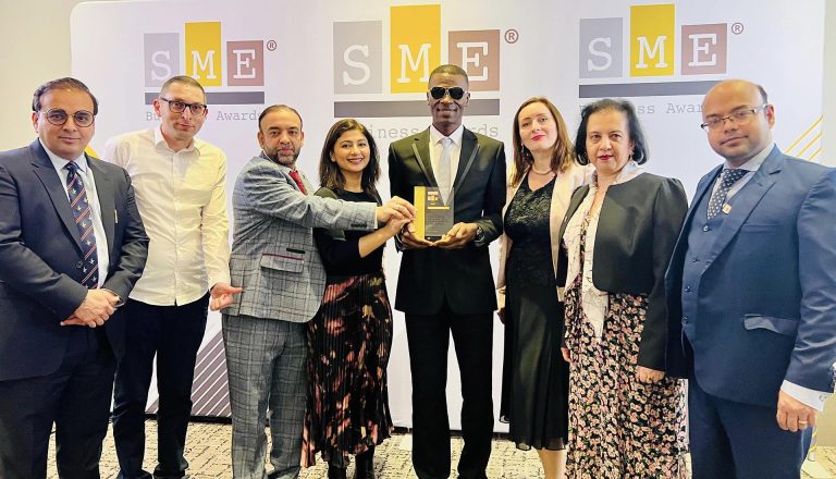 Mont Rose College representatives celebrating their achievement at the SME London Chamber of Commerce Awards, holding a prestigious award.