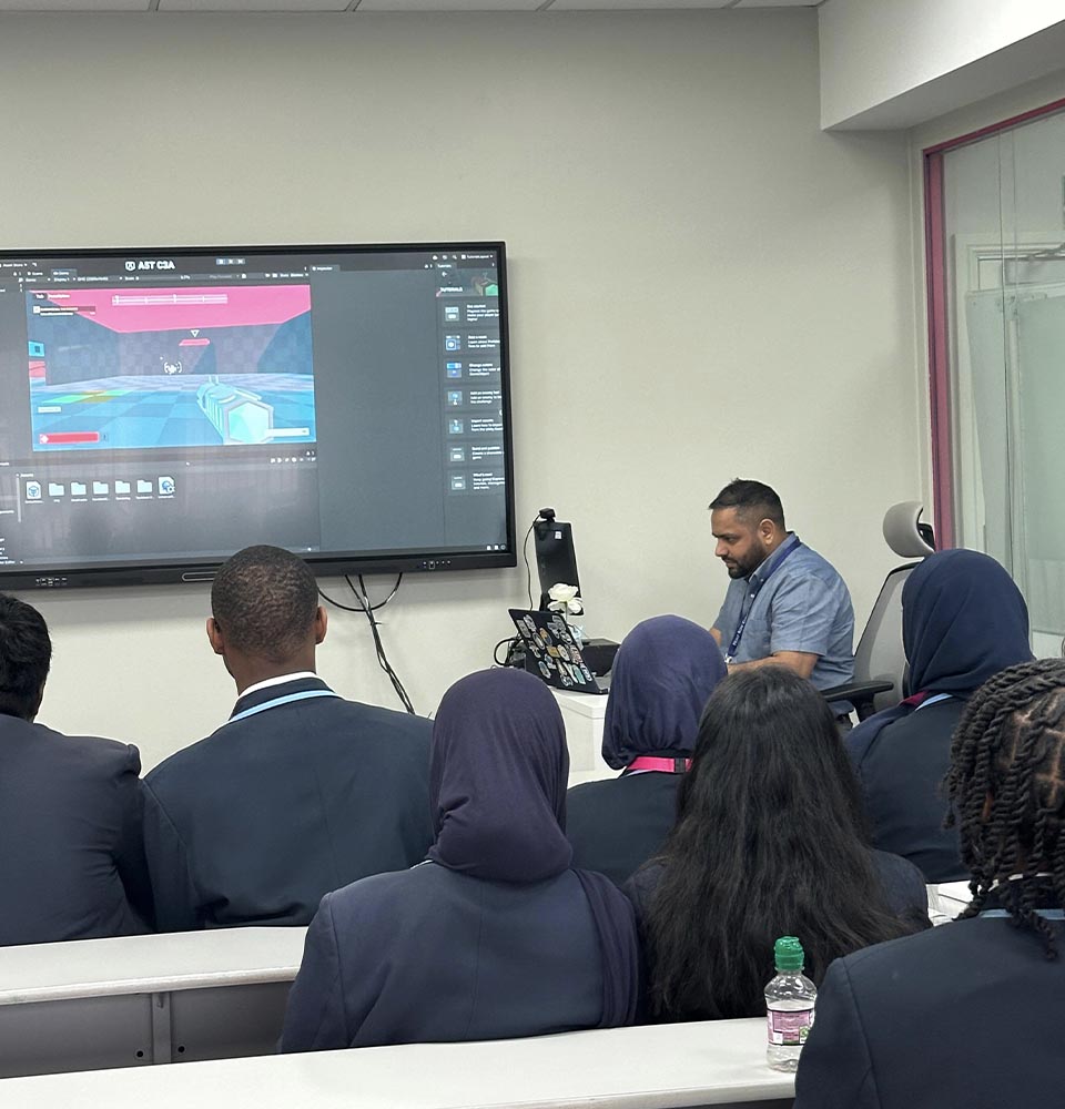 Instructor demonstrating game development software to Cumberland High School students during a classroom workshop on digital technologies.