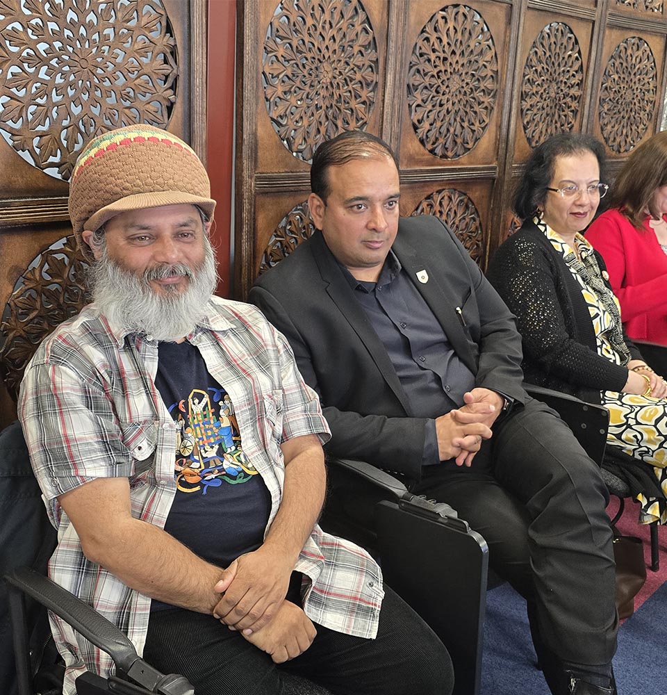 Attendees seated and listening during an Environment Day event, highlighting community engagement and sustainability discussions.