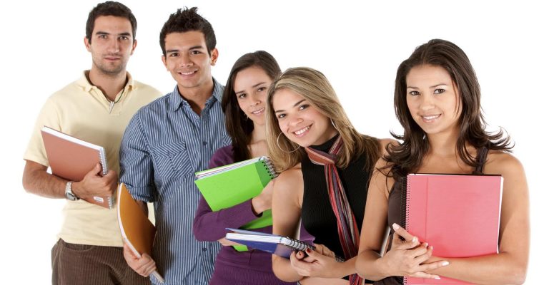 Group of smiling students holding notebooks, representing the concept of HND vs Diplomas in education choices.