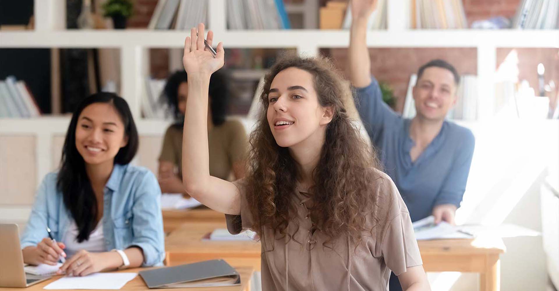 Students actively participating in class, representing the educational comparison between HND vs Professional Qualifications.