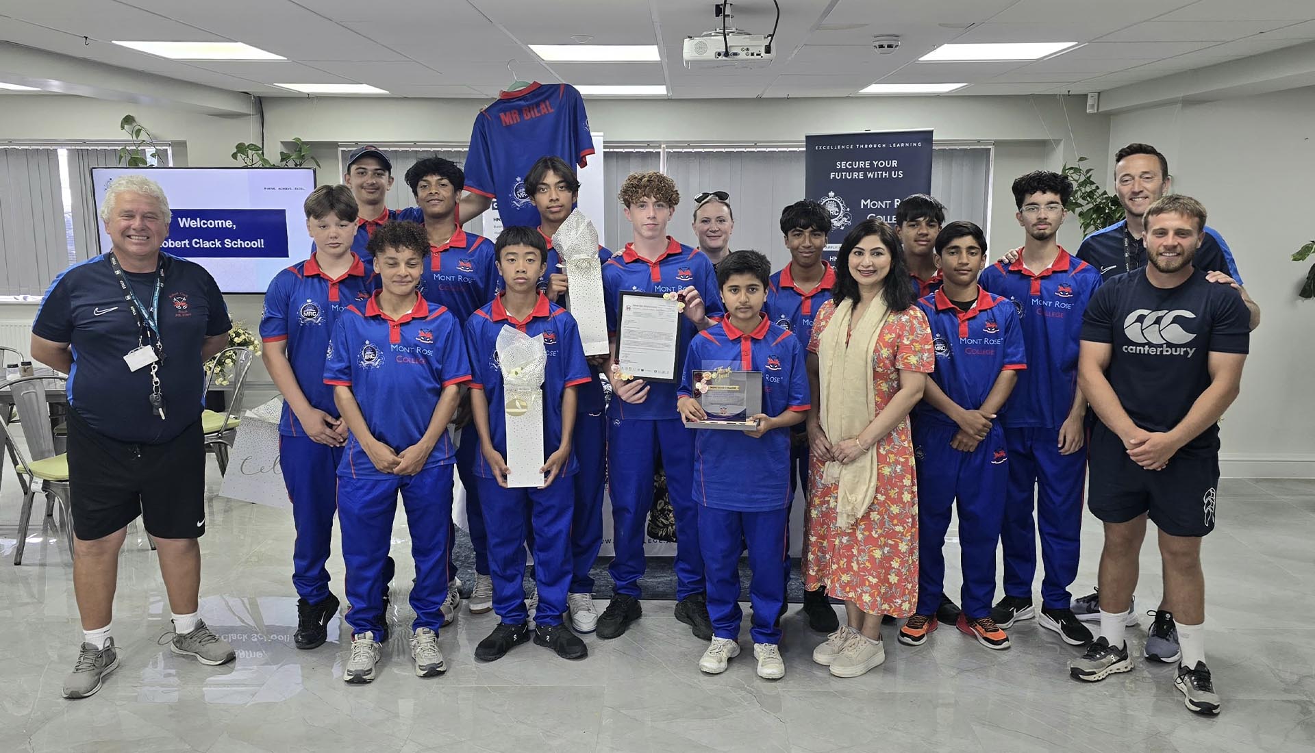 Group of students and staff from Robert Clack School and Mont Rose College celebrating student empowerment with awards and recognition.