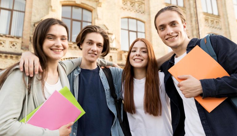 Smiling group of students standing outside campus, representing the benefits of pursuing HND and Part-Time Degree programs.
