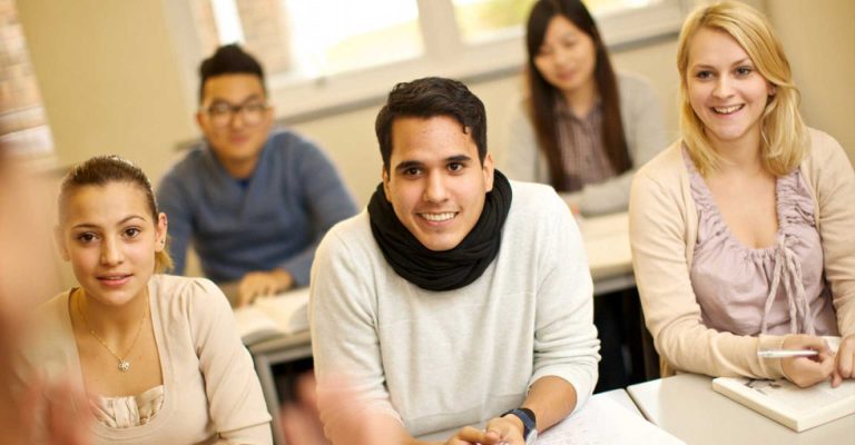 Students sitting in a classroom, listening attentively, representing a guide to applying for HND courses.